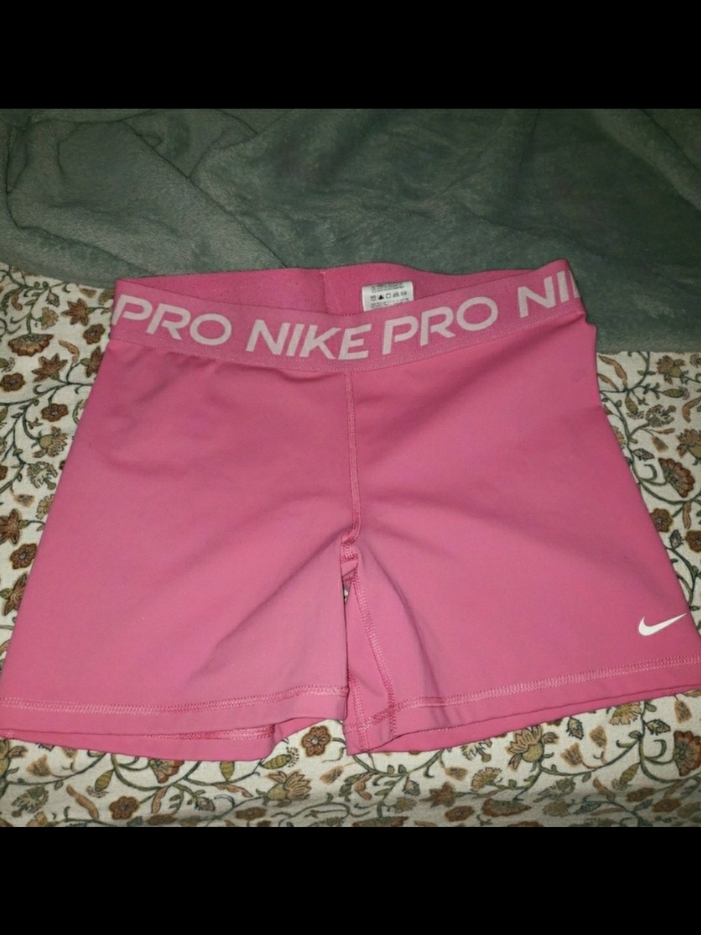 Nike Pink Stretch Athletic Shorts with White Swoosh